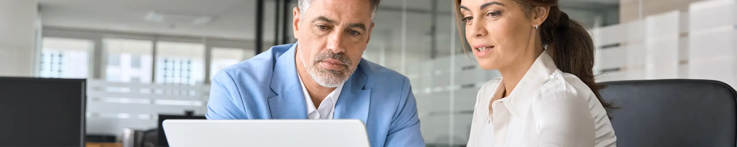 An executive working collaboratively with a colleague