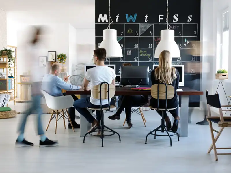 Coworkers busy working in a modern office.