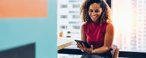 Woman smiling at laptop